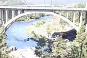 From one bridge, devoted to pedestrian use, the freeway bridge can be seen. Looking down river toward rapids and beautifully developed park the view is spectacular.