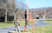 Sunnyside Grounds wraps some light poles with Christmas glow!