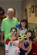 Grandchildren visit with Calvin for the fall festival.