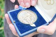 Reverse side of Frank Shakespeare's Olympic gold medal
